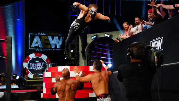 Sting leaps onto opponents during a tag team match at AEW's Double or Nothing